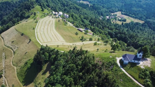 Drone Aerial View Sveti Jakob Church On Top Of Green Hills, Slovenia. photo