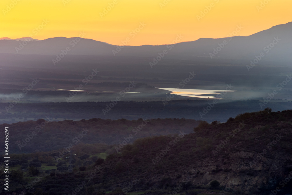 Panoramic view of the Gabriel and Galan Reservoir at sunset with little water due to the drought