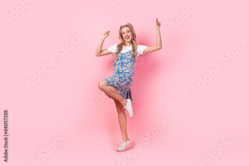 Full body portrait of overjoyed adorable lady have good mood dancing isolated on pink color background