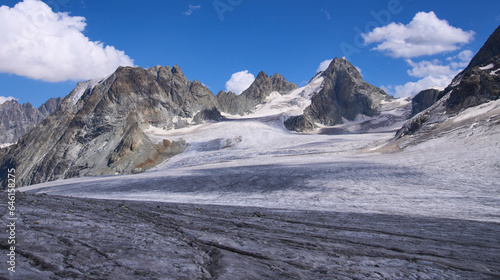 Panoramic view on the Glacier d'Arolla on the way to Vignettes alpine Swiss mountain hut. The famous Glacier Haute Route from Chamonix to Zermatt. A lot of crevasses in the glacier. Mountaineering.