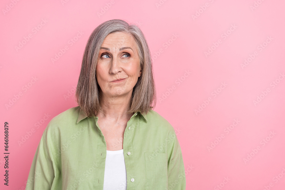 Photo of beautiful funny business woman retired khaki shirt look serious idea doubts about new employee isolated on pink color background Photo of beautiful funny business woman retired khaki shirt look serious idea doubts about new employee isolated on pink color background