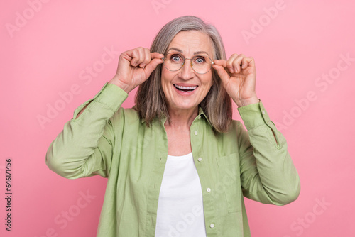 Photo of pensioner grey white hair woman take off her eyeglasses see you surprised perfect oculist isolated on pink color background