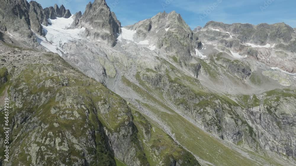 A drone shot of the snow covered peaks of the Alps. A drone shot of the snow covered peaks of the Alps.