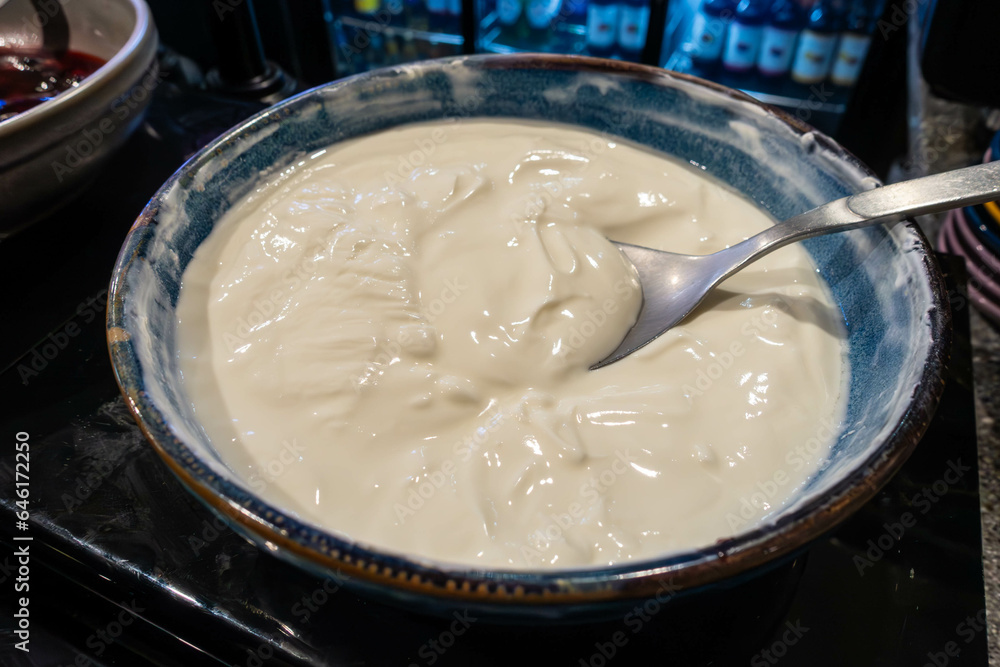A bowl of fresh yoghurt at a self service breakfast buffet in a hotel A bowl of fresh yoghurt at a self service breakfast buffet in a hotel