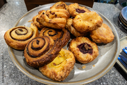 A plate of pastries at a help yourself, self service breakfast buffet in a hotel
