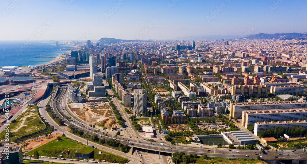 Aerial panoramic view of Barcelona modern neighborhood of Diagonal Mar i el Front Maritim del Poblenou on Mediterranean coast, Spain