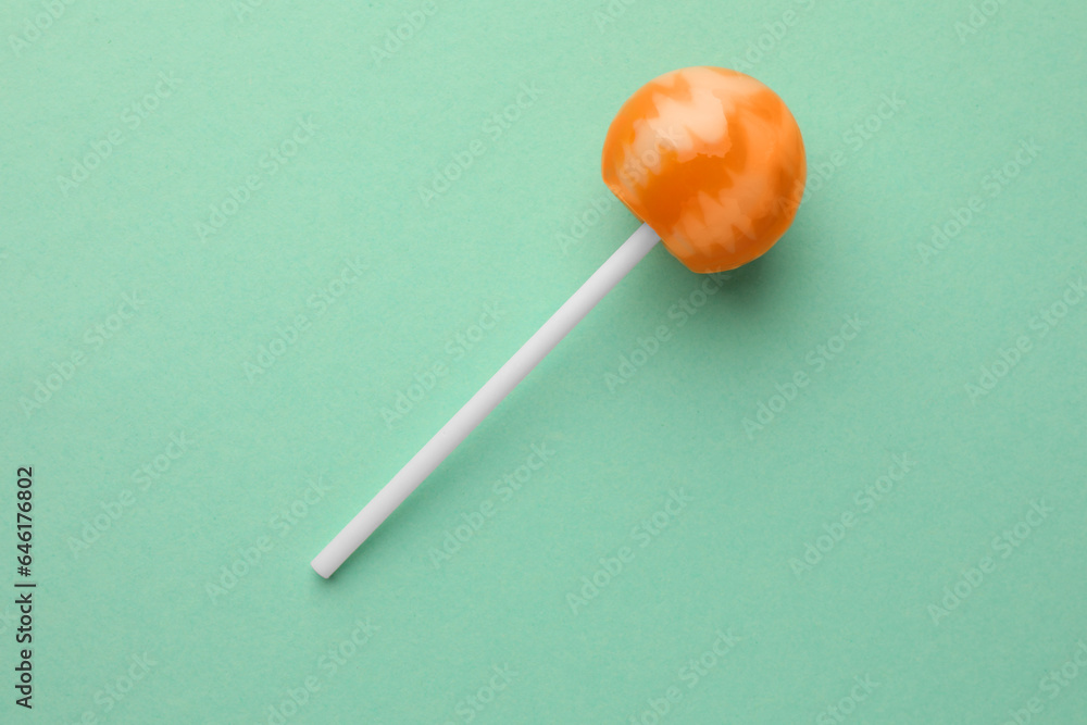 Tasty lollipop on turquoise background, top view Tasty lollipop on turquoise background, top view