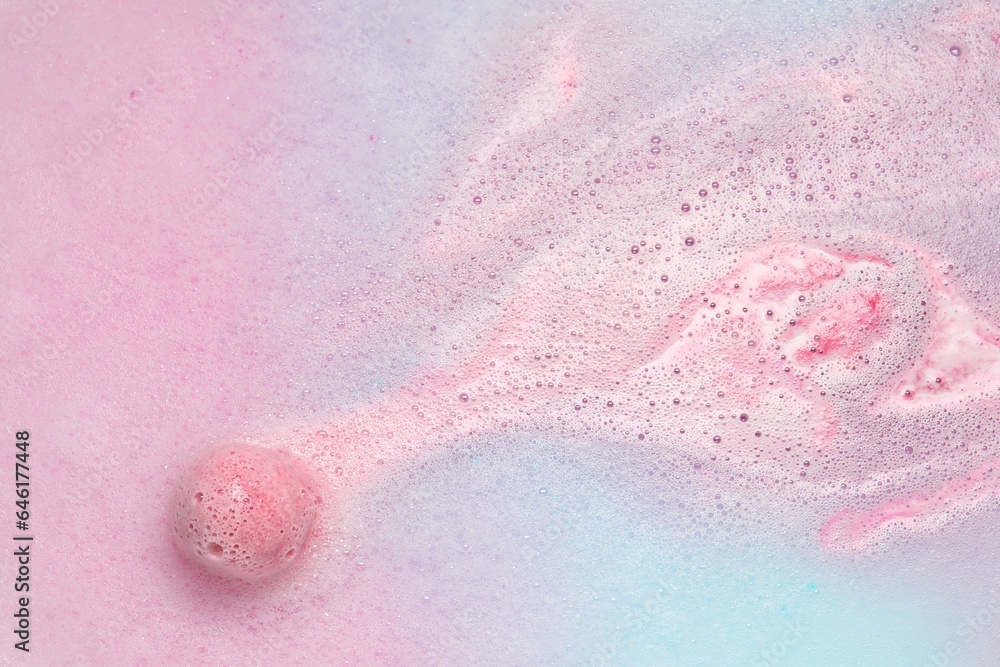 Fototapeta premium Beautiful pink bath bomb dissolving in water