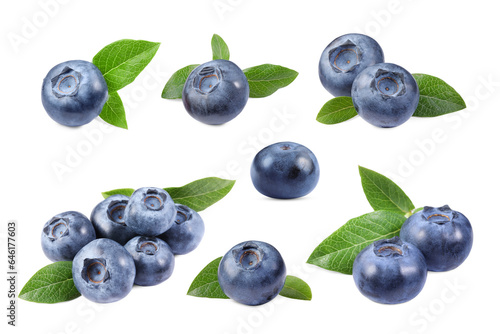 Set with fresh ripe blueberries and green leaves isolated in white