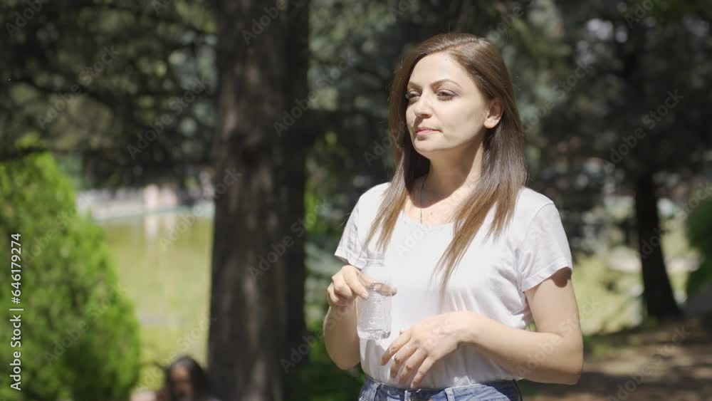 The woman is drinking water. Water for healthy life. The woman is drinking water. Water for healthy life.