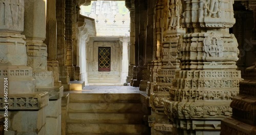 Inside the sacred Ranakpur Jain temple or Chaturmukha Dharana Vihara. Marble ancient medieval carved sculpture carvings of sacred religious place of jainism worship. Ranakpur, Rajasthan. India photo