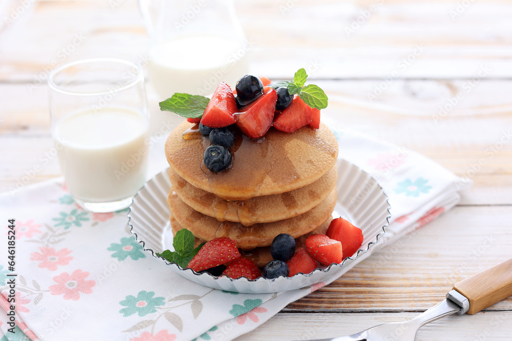 Stacked Pancakes with Strawberry, Blueberry, and Maple Syrup