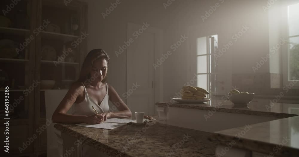 Young female composer composing music in apartment Young female composer composing music in apartment