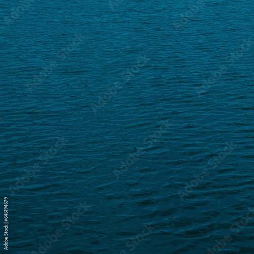 Teal ocean color with copy space. Ripples wave water of calming sea. Dark blue nature background.