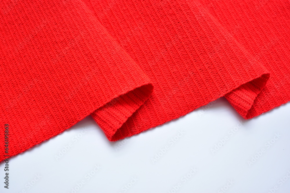 wavy of red wool knitted yarn texture, woolen fabric on white background wavy of red wool knitted yarn texture, woolen fabric on white background