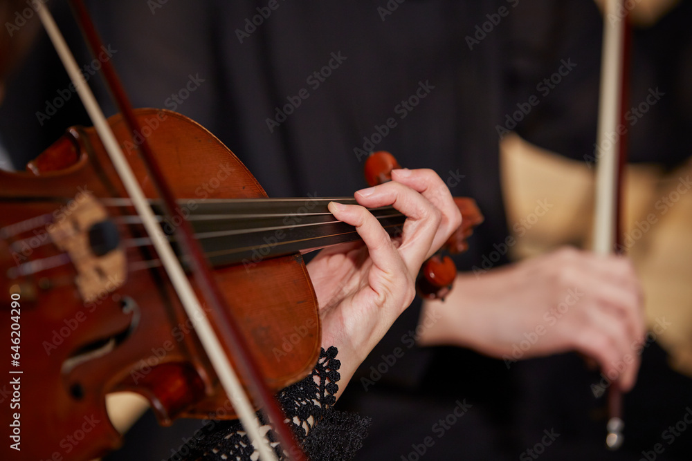 Close up of musician hands playing violin Close up of musician hands playing violin