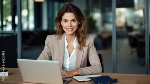 Professional business woman manager executive working on laptop computer in office.