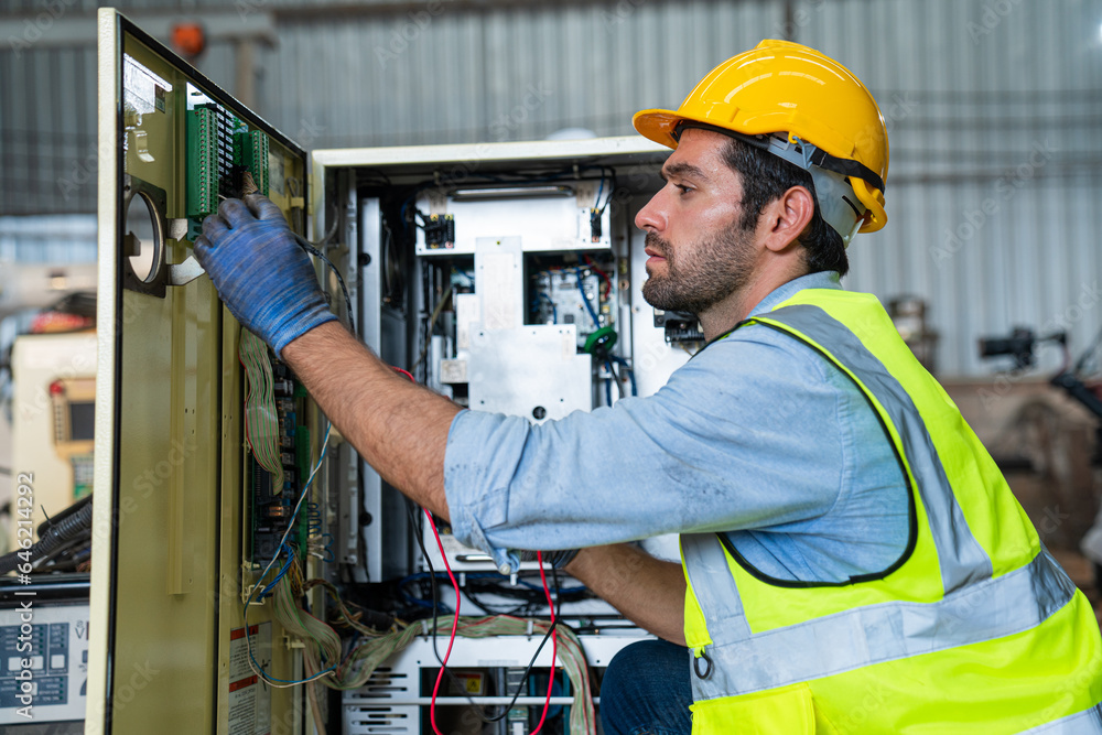 Male technician worker checking and repair pressing metal machine at factory, Machine maintenance technician operation concept. Male technician worker checking and repair pressing metal machine at factory, Machine maintenance technician operation concept.