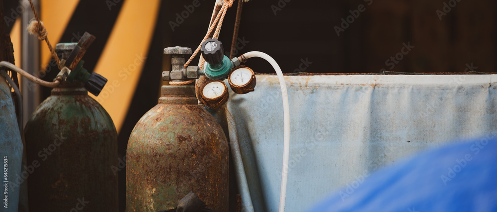 a rusty high-pressure gas canister