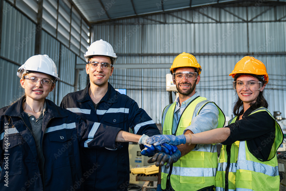 Portrait of automation engineer team standing and looking camera in industrial factory. Portrait of automation engineer team standing and looking camera in industrial factory.