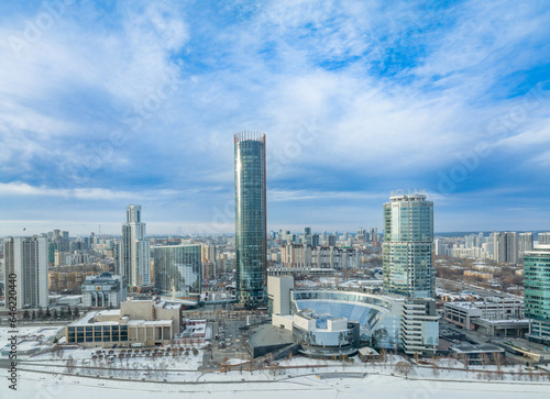 Yekaterinburg city with Buildings of Regional Government and Parliament, Dramatic Theatre, Iset Tower, Yeltsin Center, panoramic view at winter sunset.