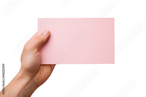 A human hand holding a blank sheet of pink paper or card isolated on a white background
