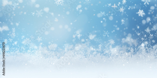 Winter snow background with snowdrifts, with beautiful light and snow flakes on the blue sky, beautiful bokeh circles, banner format, copy space