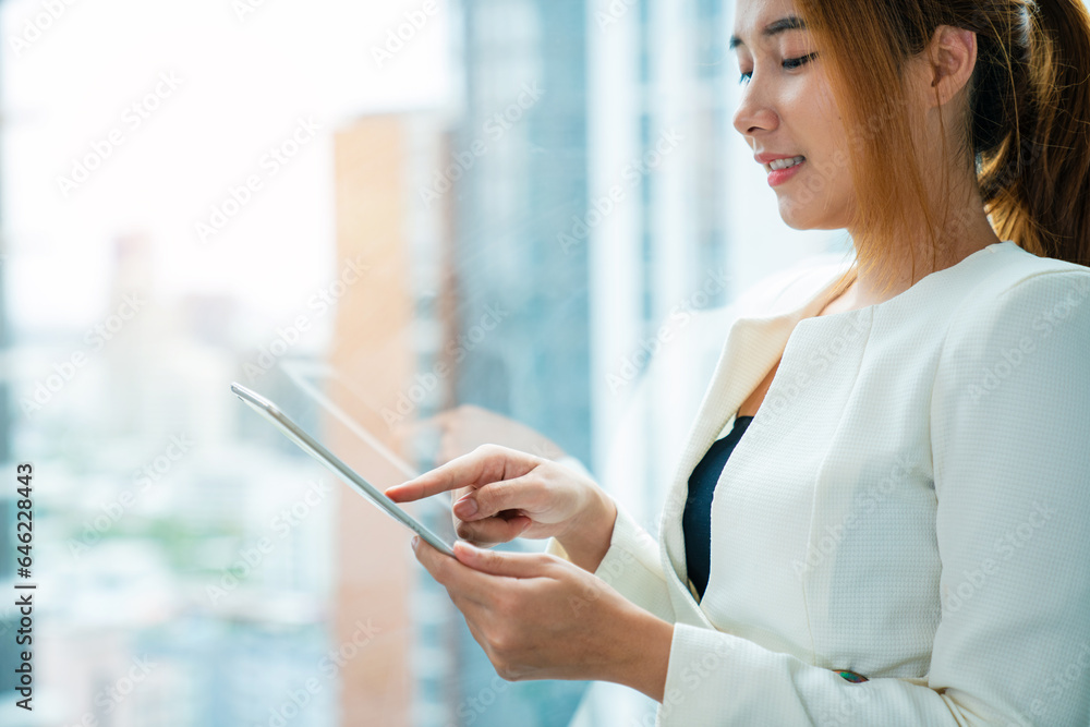 portrait of young beautiful asian woman using mobile phone in modern office. portrait of young beautiful asian woman using mobile phone in modern office.