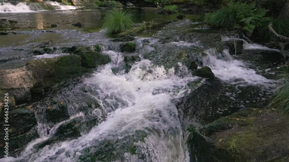 Torrent Over Mossy Rocks On Anllóns River In Refugio de Verdes, A Coruña, Spain. Static Shot Torrent Over Mossy Rocks On Anllóns River In Refugio de Verdes, A Coruña, Spain. Static Shot