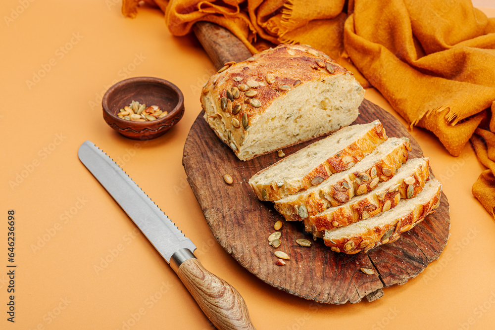 Fresh bread with pumpkin seeds. Home baking concept. Autumn decor Fresh bread with pumpkin seeds. Home baking concept. Autumn decor