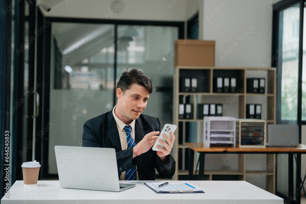 Mature business man executive manager looking at laptop watching online webinar training or having virtual meeting video conference doing market research working Mature business man executive manager looking at laptop watching online webinar training or having virtual meeting video conference doing market research working
