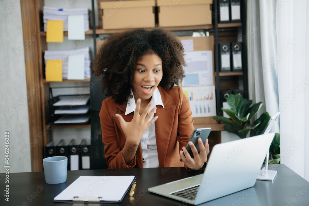 African business woman are delighted and happy with the work they do on their tablet, laptop and taking notes at office. African business woman are delighted and happy with the work they do on their tablet, laptop and taking notes at office.