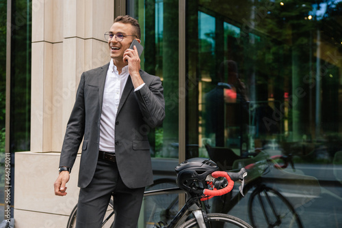 Handsome young businessman talking on the phone photo