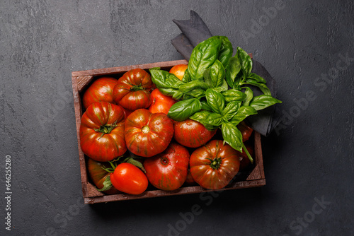 Assorted tomatoes in rustic crate