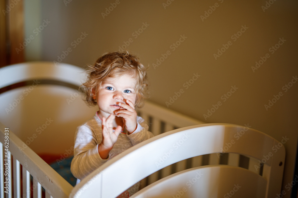 Cute Little Baby Girl Lying in Cot after Sleeping. Healthy Happy Child