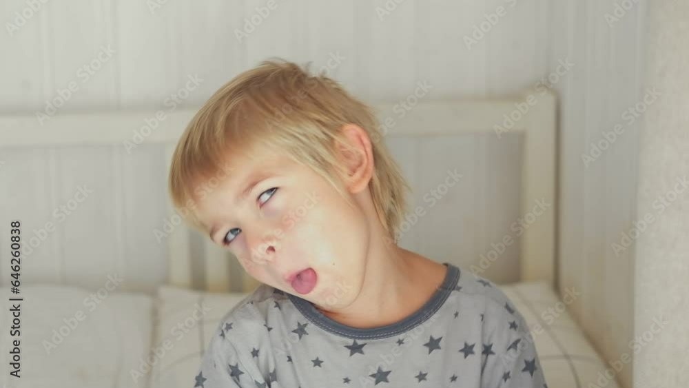 5 years Boy joking, sticking tongue out with silly expression. Child making face. Funny foolishness portrait of little boy in white bedroom. Adorable caucasian kid making crazy and comical gesture.
5 years Boy joking, sticking tongue out with silly expression. Child making face. Funny foolishness portrait of little boy in white bedroom. Adorable caucasian kid making crazy and comical gesture.