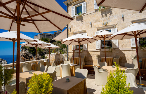 interior of an open air restaurant on the street of the old town, vintage architecture, the concept of traveling through the Balkans, sea and mountains