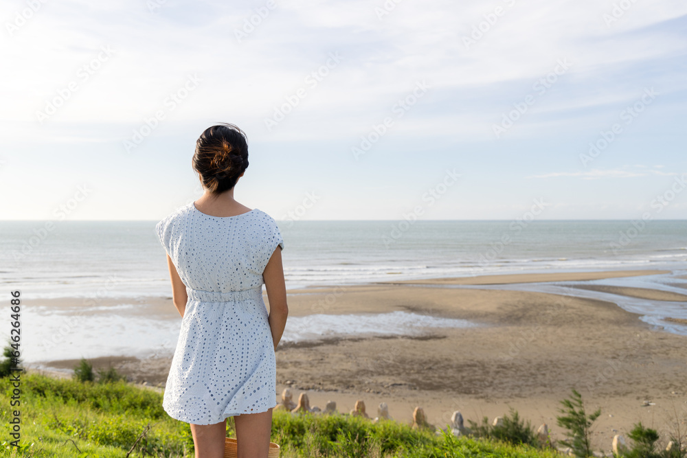 Woman enjoy the sand beach view on the top