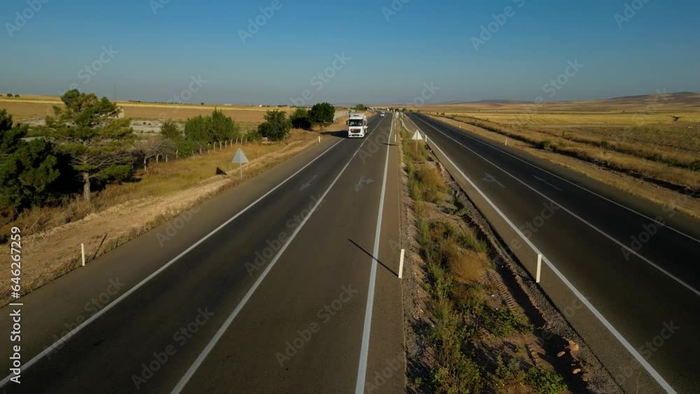 Drone flying over the road and vehicles driving on the road Drone flying over the road and vehicles driving on the road