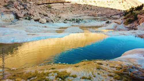 a river in the middle of the sahara desert Algeria Biskra photo