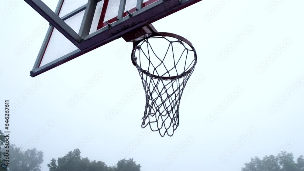 view of basketball hoop outdoors misty weather view of basketball hoop outdoors misty weather