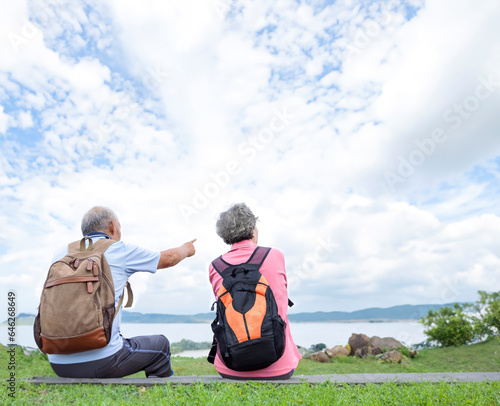 Rear view Senior couple hiking on the mountain