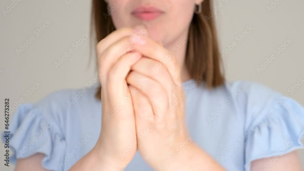 Young woman applying moisturizing cream to her hands on white background, selective focus. Young woman applying moisturizing cream to her hands on white background, selective focus.