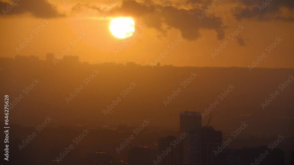 Dreamy orange sky at dusk. The complete sunset process. Night view of the city surrounded by mountains is hazy and dreamy. Dajianshan, Taiwan Dreamy orange sky at dusk. The complete sunset process. Night view of the city surrounded by mountains is hazy and dreamy. Dajianshan, Taiwan