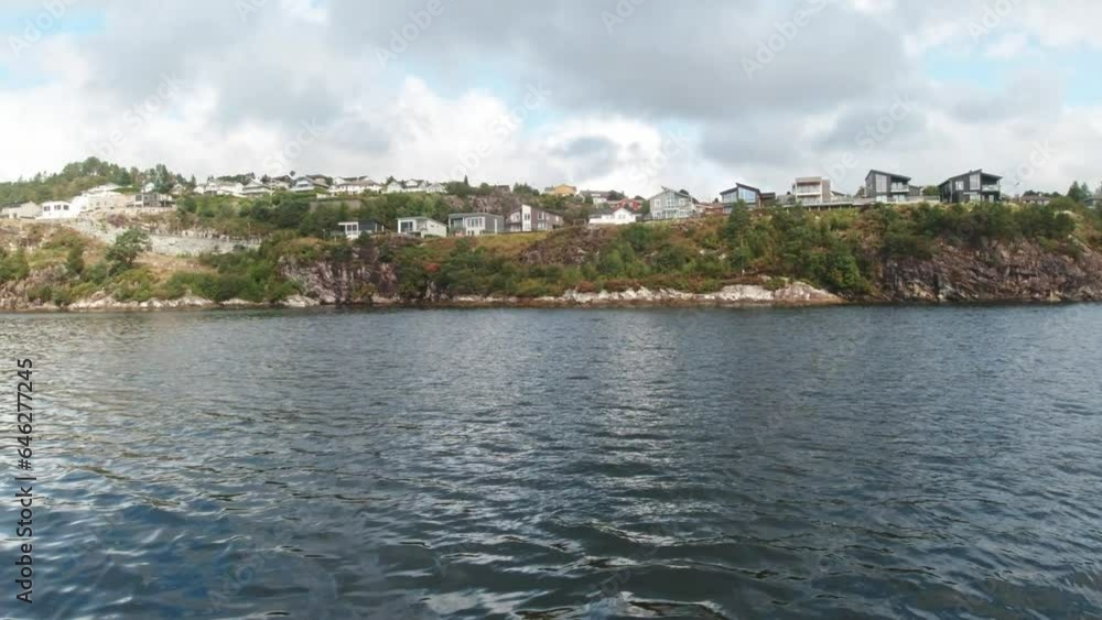 Beautiful Houses on Top of Cliffs Along a River Boat Trip from Bergen in Norway. Beautiful Houses on Top of Cliffs Along a River Boat Trip from Bergen in Norway.