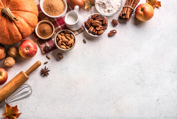 Autumn baking background with pumpkins, apples and nuts