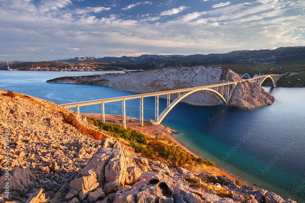 Krk Bridge, Croatia. Image of Krk Bridge which connects the Croatian island of Krk with the mainland at beautiful summer sunrise.