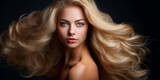 Beautiful young woman with healthy wavy long blonde hair. Hair Style, hair dye, hair care