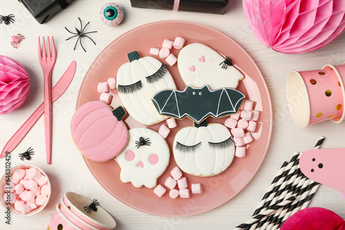 Halloween themed cookies in a bowl. Pink Halloween concept