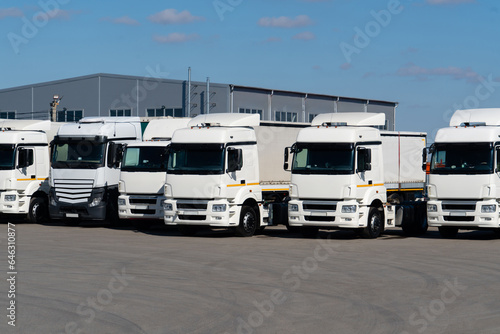 Semi truck fleet at the logistics center © scharfsinn86